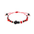 This Genuine Jet Azabache Red String Bracelet for Adults showcases vibrant beaded patterns with alternating red, black, and blue beads, highlighted by a central black bead in the shape of a cross. Strung on an adjustable red cord, it combines style with positive energy for those seeking protection from the evil eye.